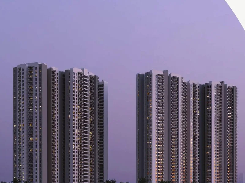 Solcrest towers silhouetted at dusk above water and landscape — artist's impression